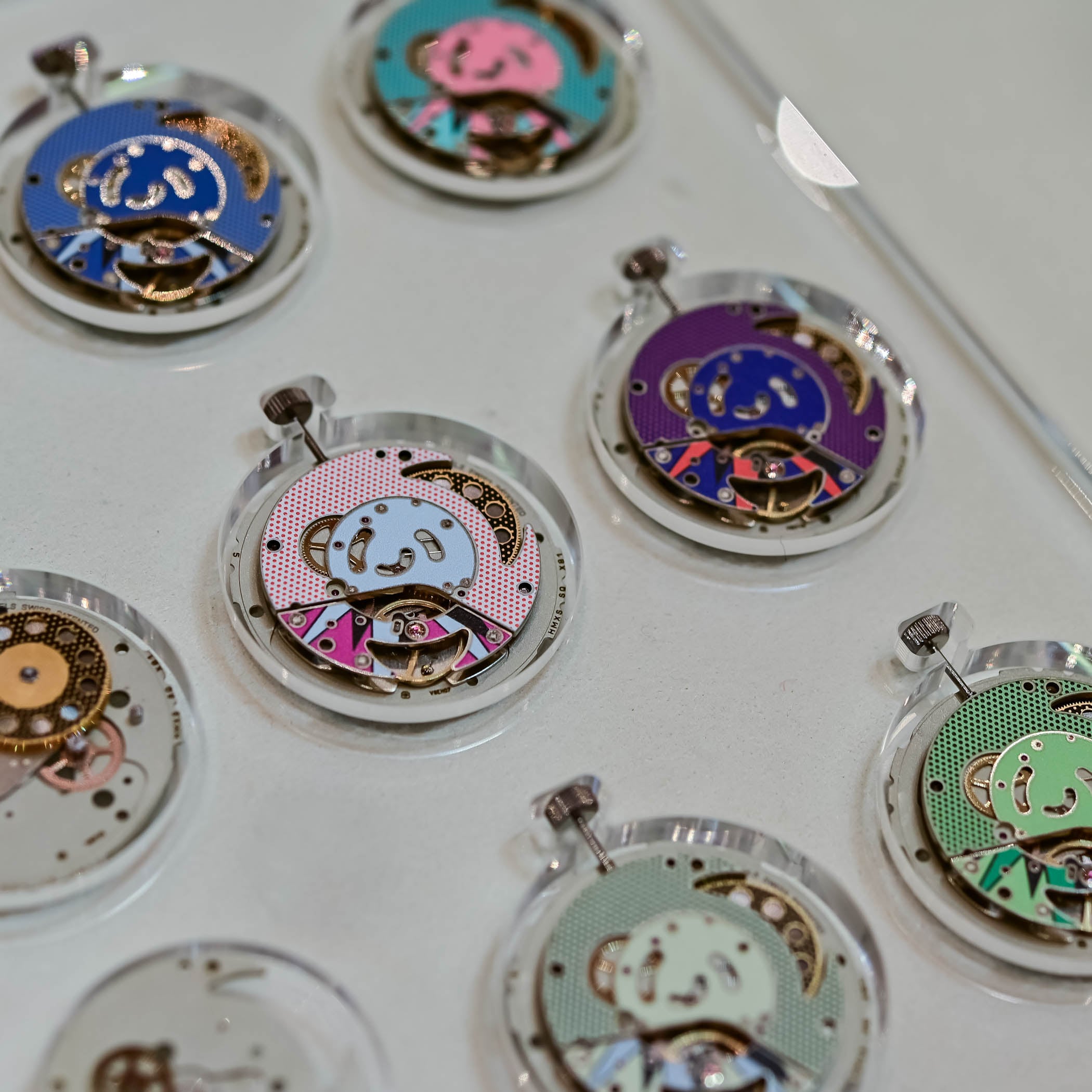 Swatch Royal Pop reconstructed hand-wound Sistem51 movements with pop-art decorated rotors across the eight colorways