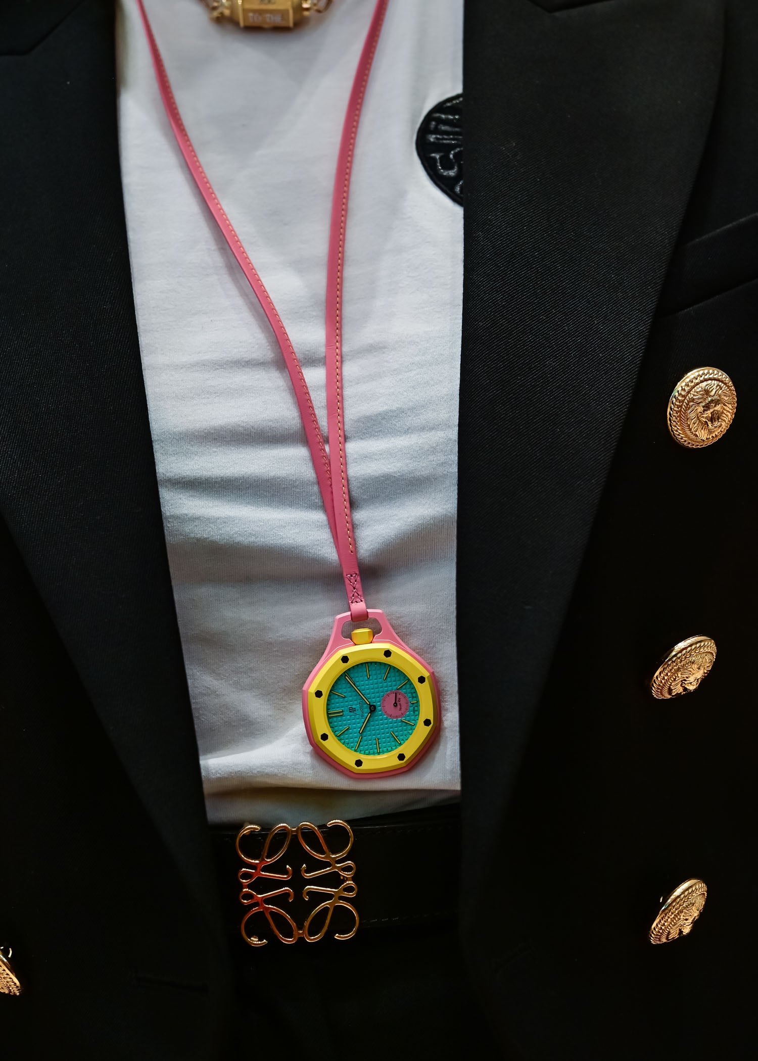 Swatch Royal Pop Otg Roz Savonnette pocket watch worn on a pink calfskin lanyard